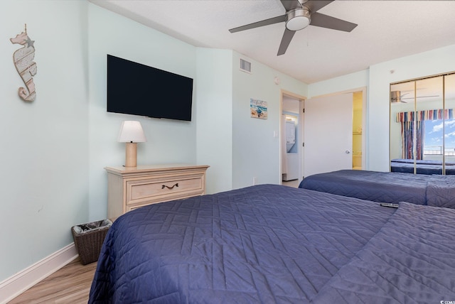 bedroom featuring ceiling fan and light wood-type flooring