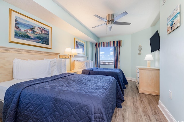 bedroom featuring ceiling fan and light wood-type flooring