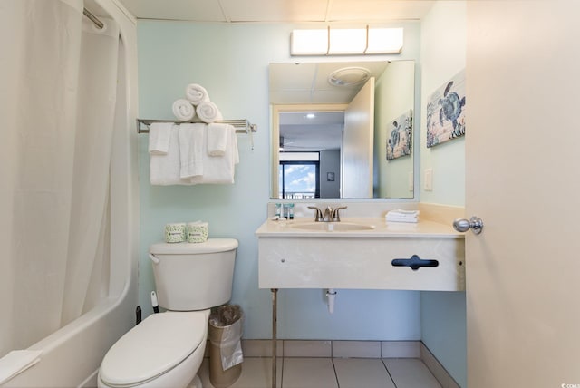 full bathroom featuring shower / bath combo, sink, tile patterned floors, and toilet