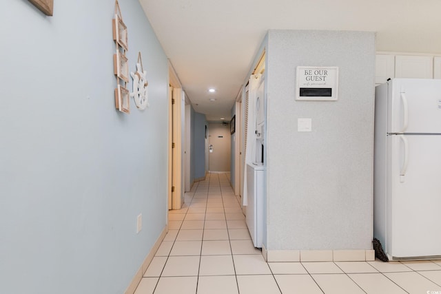 corridor featuring light tile patterned flooring