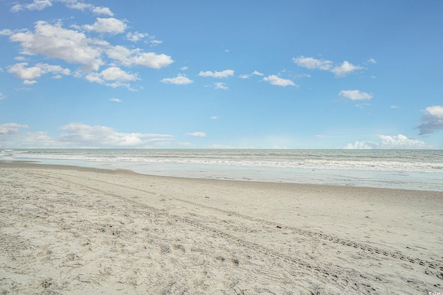 property view of water featuring a beach view