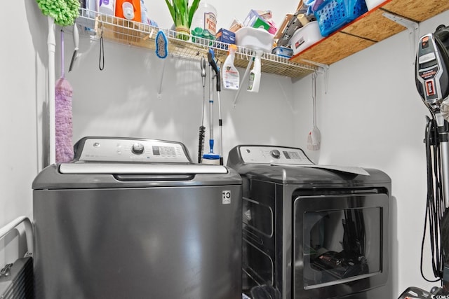 clothes washing area with laundry area and washing machine and dryer