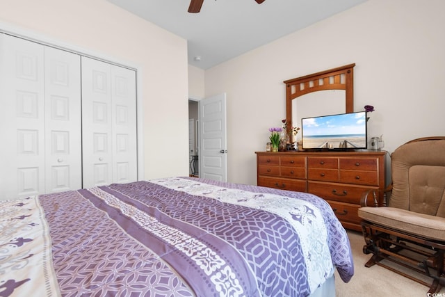 carpeted bedroom featuring a closet and a ceiling fan