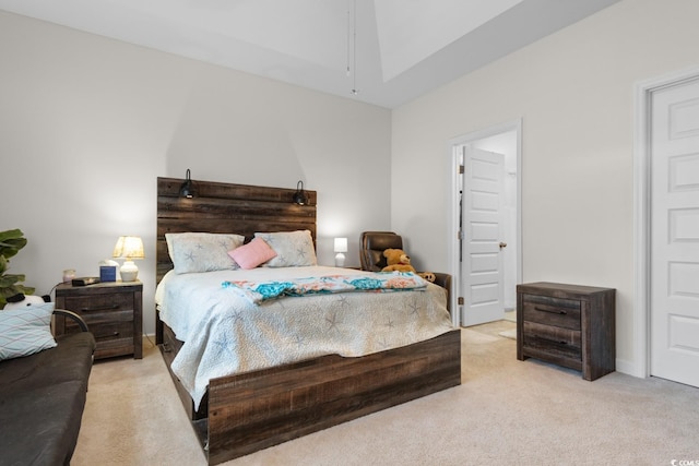 bedroom featuring light colored carpet