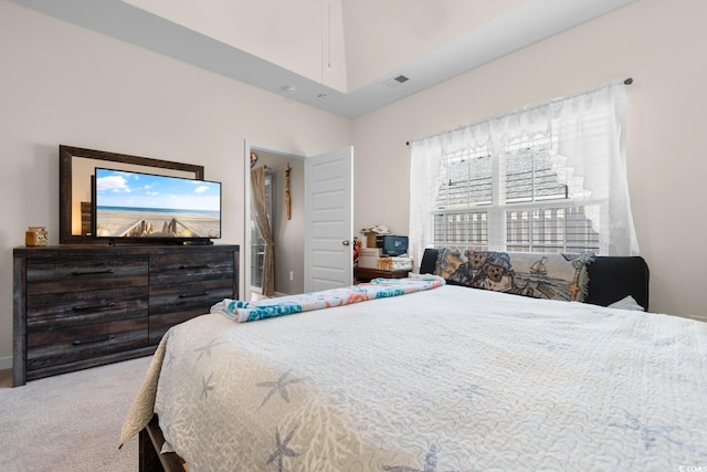 carpeted bedroom featuring visible vents