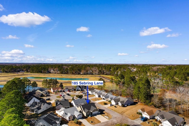 aerial view with a water view, a residential view, and a view of trees