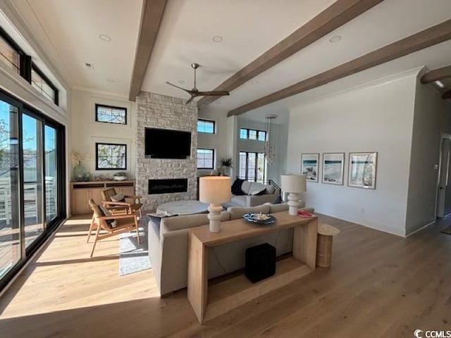 429 Harbour View Dr, Myrtle Beach, SC 29579 - living area with a ceiling fan, beamed ceiling, a fireplace, and wood finished floors