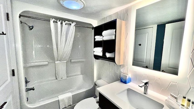 full bathroom with vanity, toilet, and shower / bath combo with shower curtain