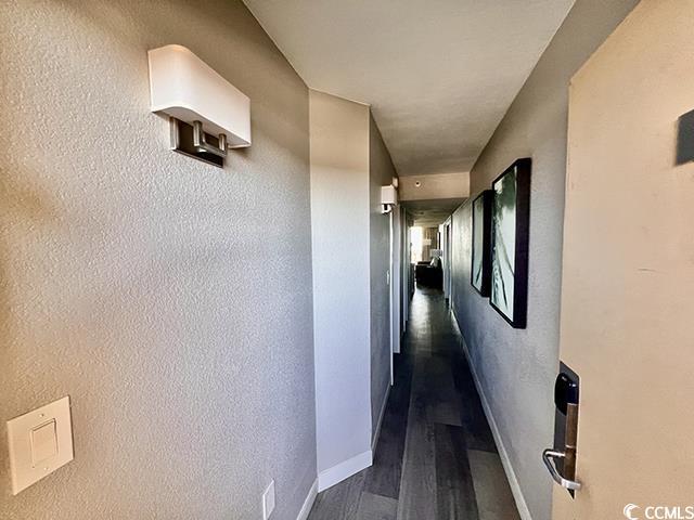 hall with dark hardwood / wood-style floors