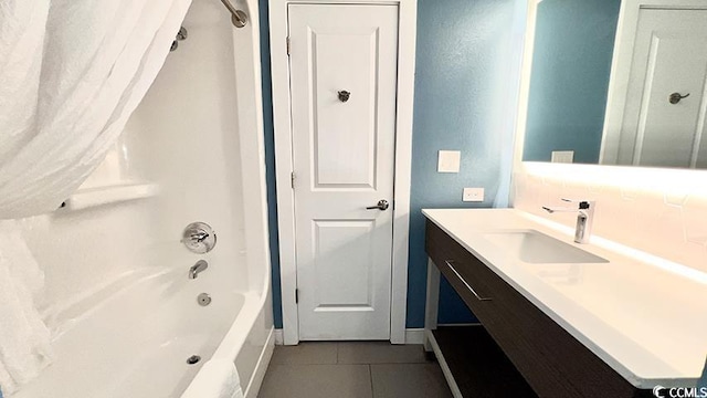 bathroom featuring shower / bath combination with curtain, tile patterned floors, and vanity