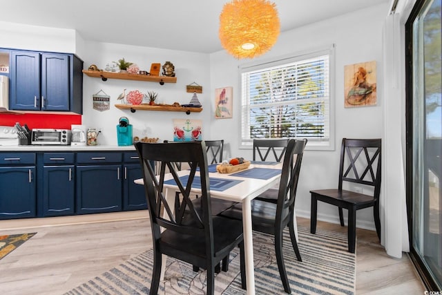 dining room featuring light wood-type flooring