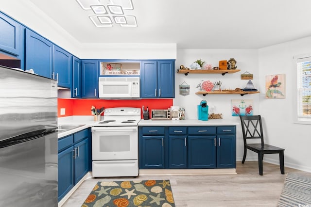 kitchen with blue cabinets, light wood-type flooring, sink, and white appliances