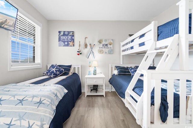 bedroom with hardwood / wood-style flooring