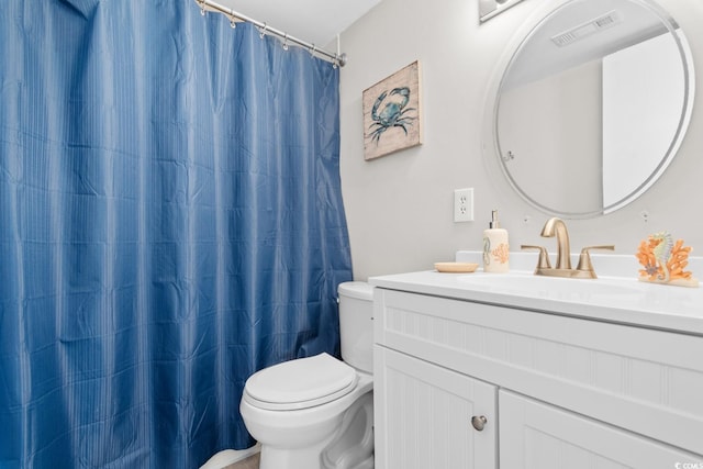 bathroom with a shower with curtain, vanity, and toilet