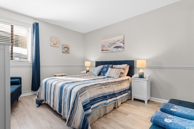 bedroom with light wood-type flooring