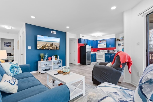 living room with light hardwood / wood-style floors