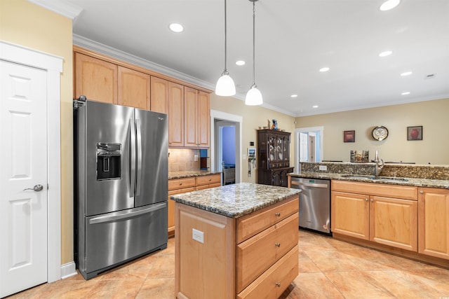 kitchen featuring sink, a center island, ornamental molding, stone counters, and stainless steel appliances