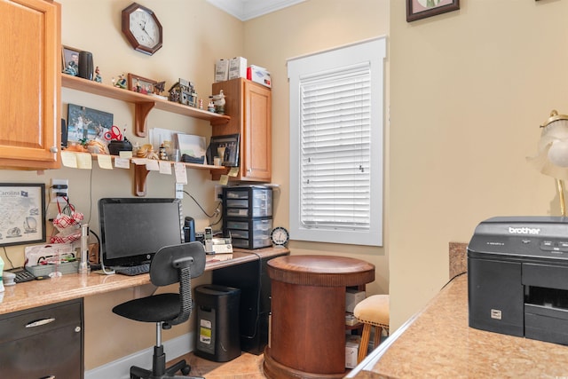 office with built in desk and a healthy amount of sunlight