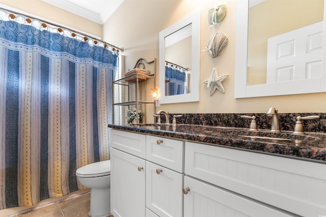 bathroom featuring crown molding, vanity, toilet, and tile patterned flooring