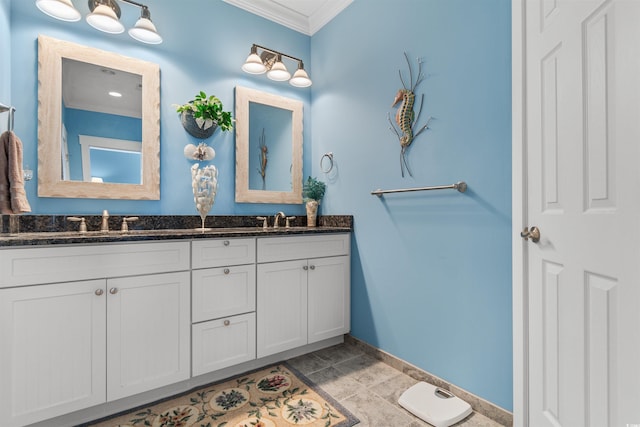 bathroom featuring crown molding and vanity