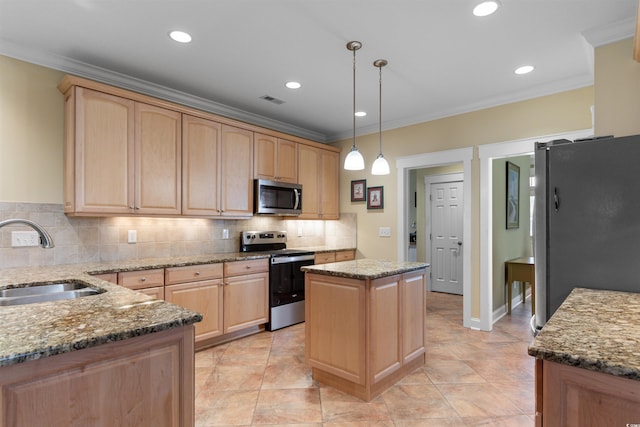 kitchen with a kitchen island, appliances with stainless steel finishes, sink, and light brown cabinets