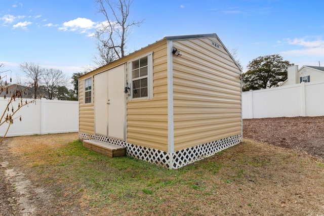 view of outdoor structure featuring a lawn