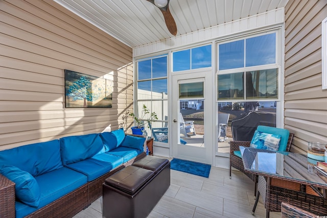 exterior space with an outdoor living space and ceiling fan