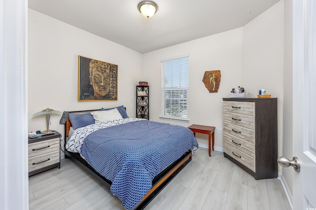 bedroom with light hardwood / wood-style flooring