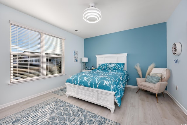 bedroom with hardwood / wood-style flooring