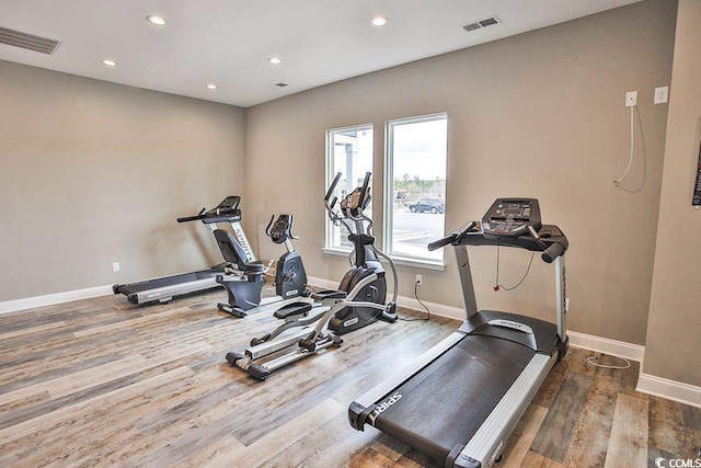 workout room with hardwood / wood-style floors