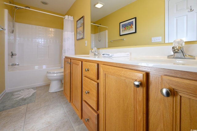 full bath featuring shower / tub combo with curtain, a sink, toilet, and tile patterned floors