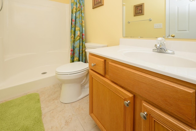 full bathroom featuring tile patterned flooring, a shower stall, toilet, and vanity