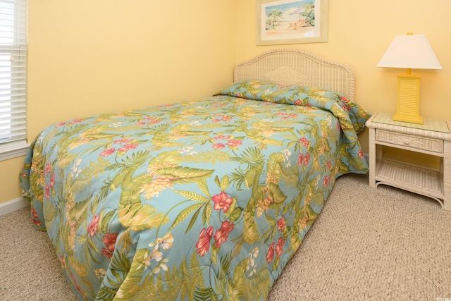 carpeted bedroom with baseboards