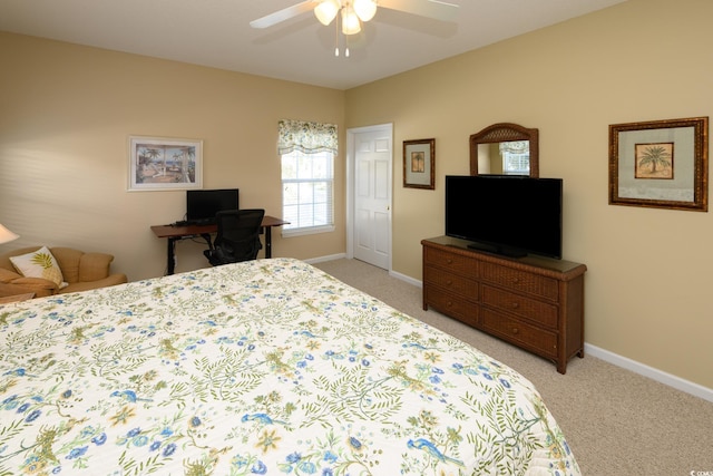 bedroom with light carpet, a ceiling fan, and baseboards