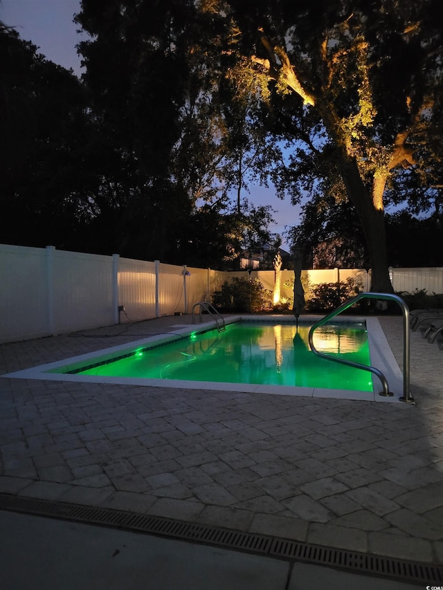 view of swimming pool with a fenced in pool, a patio area, and a fenced backyard