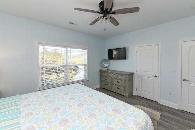 bedroom featuring hardwood / wood-style floors and ceiling fan