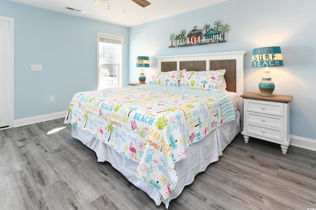 bedroom with hardwood / wood-style flooring and ceiling fan