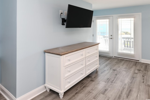 entryway featuring light hardwood / wood-style flooring and french doors