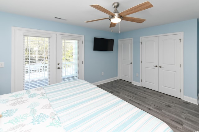 bedroom with french doors, access to outside, dark hardwood / wood-style floors, a closet, and ceiling fan