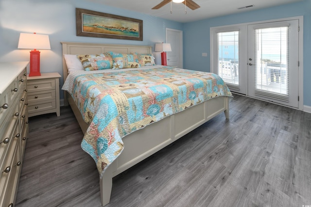 bedroom with access to exterior, dark hardwood / wood-style floors, ceiling fan, and french doors