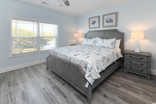 bedroom featuring ceiling fan and hardwood / wood-style floors