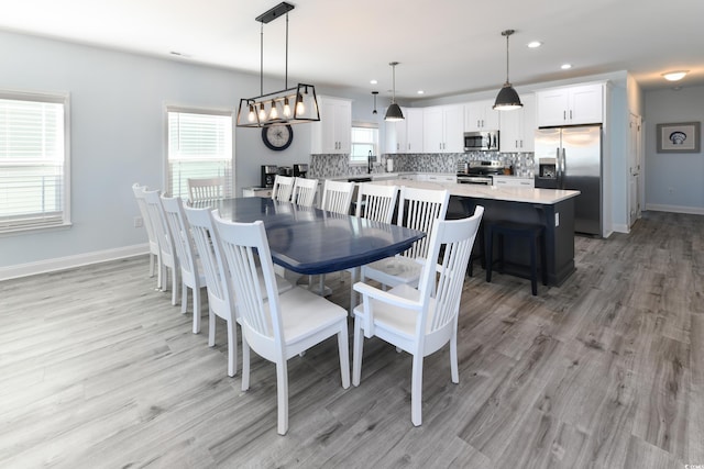 dining space featuring light hardwood / wood-style floors