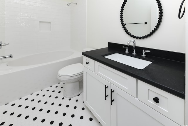 full bathroom with shower / washtub combination, vanity, and toilet