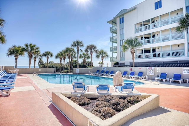 view of swimming pool featuring a patio area