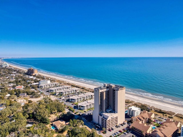 bird's eye view featuring a water view and a beach view