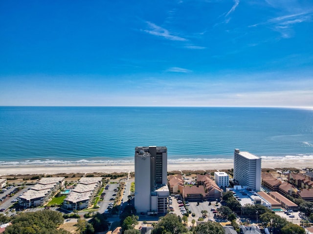 drone / aerial view featuring a water view and a view of the beach