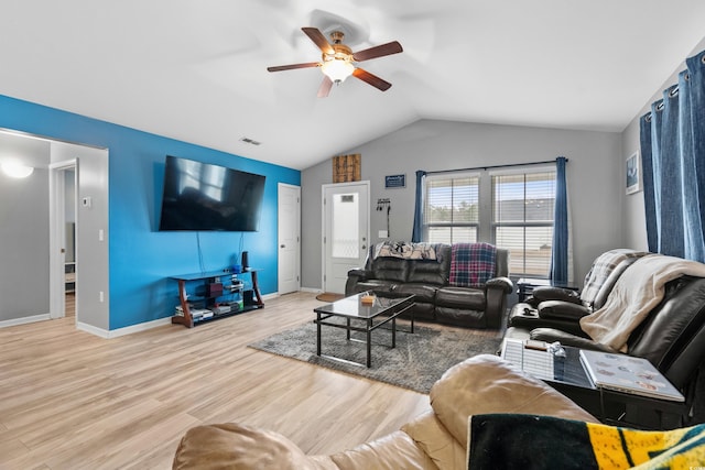 living room with lofted ceiling, light hardwood / wood-style floors, and ceiling fan