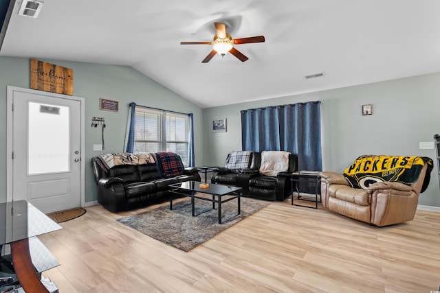 living room with lofted ceiling, ceiling fan, and light hardwood / wood-style flooring