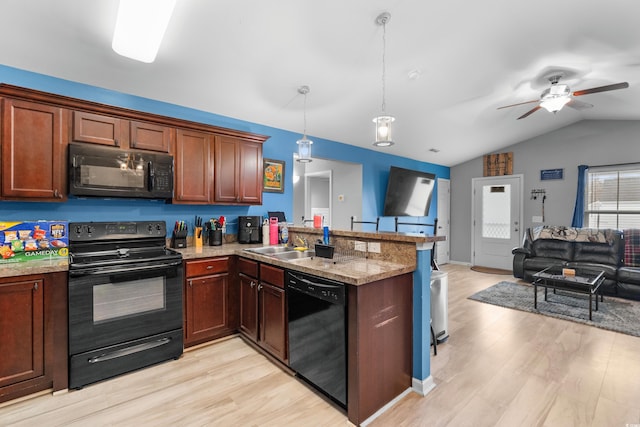 kitchen with lofted ceiling, black appliances, light hardwood / wood-style floors, decorative light fixtures, and kitchen peninsula