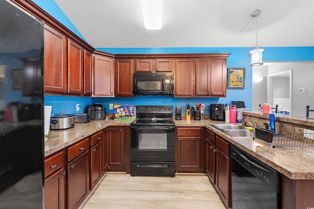 kitchen featuring hanging light fixtures, sink, kitchen peninsula, and black appliances